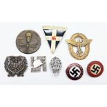 A collection of 8 Nazi German Pin Badges. A variety of designs, shapes and sizes.
