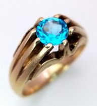 A 9K GOLD RING WITH A STUNNING BLUE AQUA GEMSTONE . 6gms size R