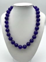 A Hypnotic Deep Purple Large Jade Beaded Necklace. 42cm necklace length. 12mm beads.