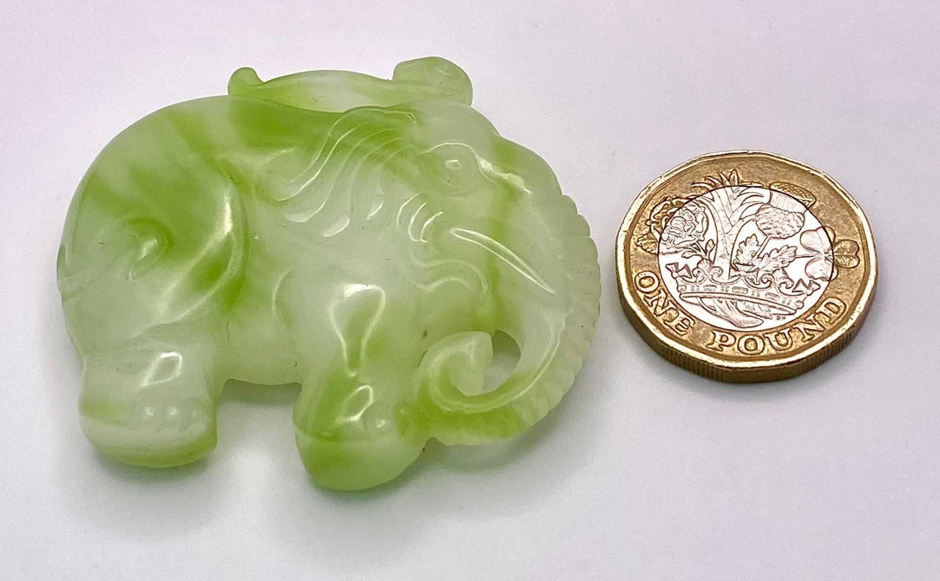 A Chinese Cauliflower Jade Elephant Pendant. 5cm x 4cm - Image 3 of 3