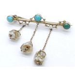 An Antique Gold, Turquoise and Pearl Bar Brooch. Three turquoise cabochons complimented with three