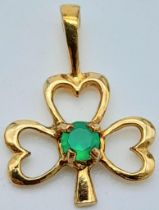 A 9K Yellow Gold Green Stone Set Three Leaf Clover Pendant. 1.7cm length, 0.6g total weight. Ref: