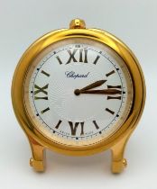A Chopard Happy Sport Gold Plated Table Clock. Quartz movement. 7.5cm diameter. White dial with