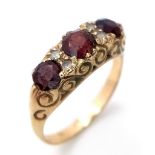 An ornamental, vintage, 9 K yellow gold ring with garnets and white sapphires. Ring size: Q, weight: