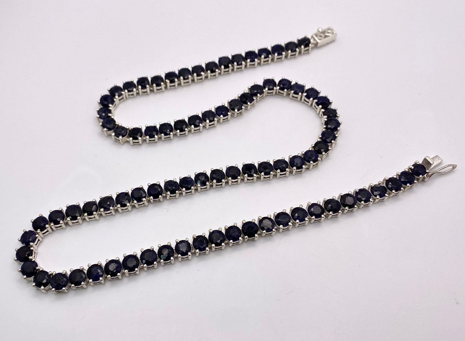 A Blue Sapphire Gemstone Tennis Necklace set in 925 Silver. 45cm length. 40.15g total weight. - Image 3 of 4