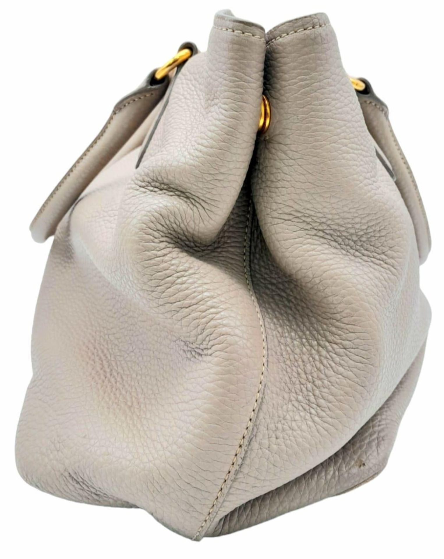A Prada Vitello Daino Tote Pomice Bag. Textured leather exterior with gold-tone hardware. Decorative - Image 2 of 9