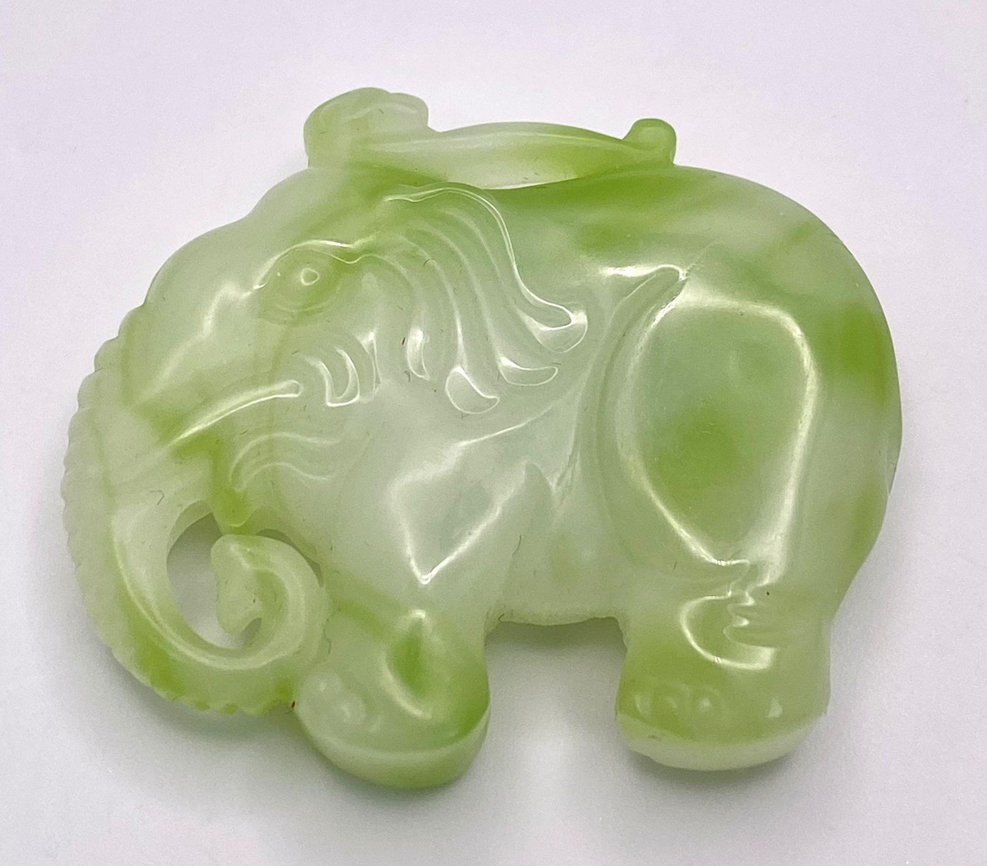 A Chinese Cauliflower Jade Elephant Pendant. 5cm x 4cm