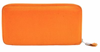 A Hermes Burnt Orange Leather Wallet. Burnt orange leather interior with zipped and open