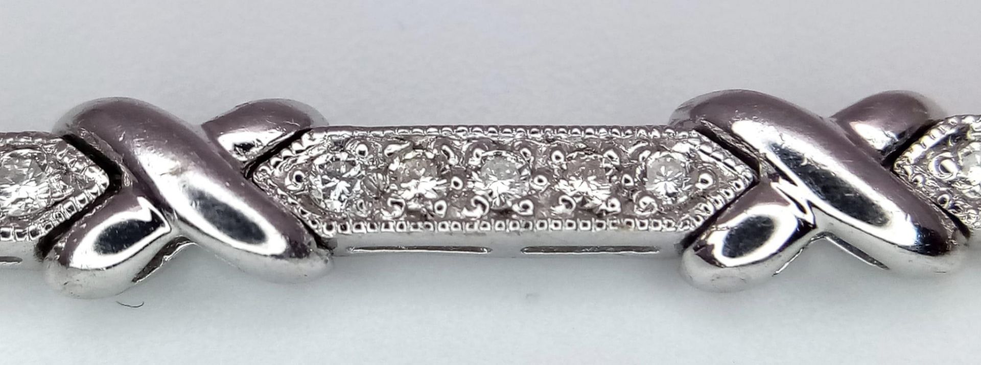 An 18K White Gold and Diamond Bar Link Necklace. 1.24ctw of diamonds. Love-knot separators. 43cm - Image 6 of 6