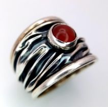 A Sterling Silver Mexican Ruby Set Bark Pattern Ring Size L. The Ring Measures 1.6cm Wide at the