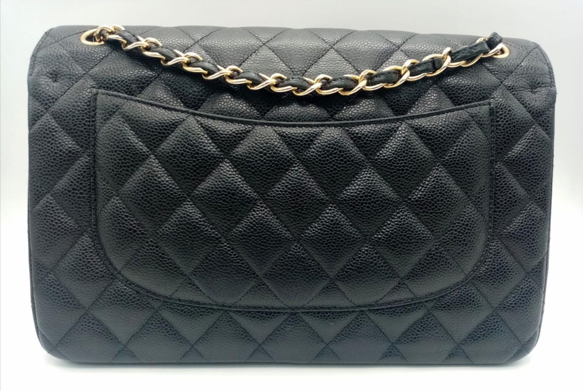 A Chanel Black Caviar Classic Double Flap Bag. Quilted pebbled leather exterior with gold-toned - Image 2 of 11