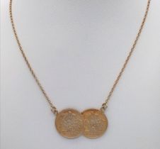 A STERLING SILVER WITH GOLD VERMEIL DOUBLE COIN NECKLACE. 48.5cm length, 8g total weight. Ref: