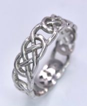 A 9K WHITE GOLD CELTIC BAND RING. Size Z+1, 4.7g total weight.