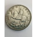 1935 SILVER ROCKING HORSE CROWN. Raised detail and definition to sides, with clear wording to