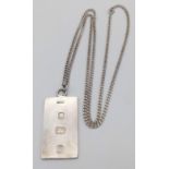A Sterling Silver Ingot Pendant on a Sterling Silver Necklace. 4.5cm and 60cm. 22g total weight.
