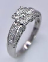 A 18K WHITE GOLD DIAMOND CLUSTER RING, WITH COMBINATION OF ROUND BRILIANTS & BAGUETTE CUTS