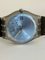 Vintage SWATCH WATCH. Blue face model with sweeping second hand and date window . Perspex case