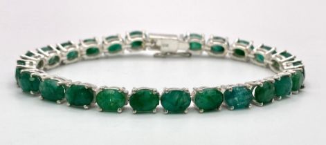 An Emerald Gemstone Tennis Bracelet set in 925 Silver. 19cm length. Ref: CD-1107