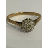 9 carat YELLOW GOLD and DIAMOND CLUSTER RING. Complete with ring box. Full UK hallmark.1.85 grams.