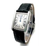 A Very Collectible Cartier 3170 Quartz Ladies Watch. Black leather strap with Cartier clasp.