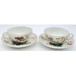 A pair of antique Japanese, hand-painted cup and saucer. Fine bone china with a delightful floral