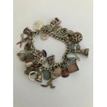Vintage SILVER CHARM BRACELET Absolutely packed with charms ,having many unusual pieces, To
