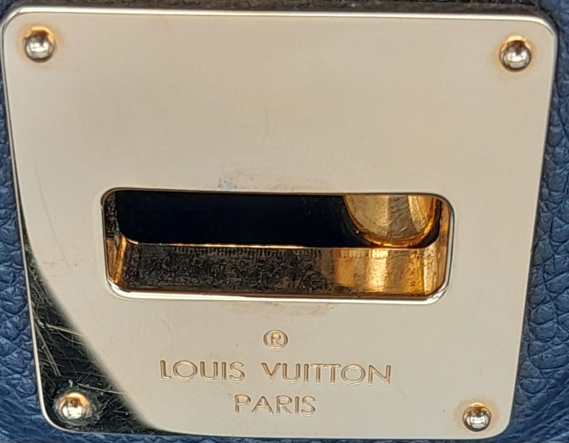 A Louis Vuitton Monogram Empreinte PM Tote Bag. Navy blue exterior with gold tone hardware. Spacious - Image 9 of 10