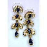 A Pair of 9K Yellow Gold, Diamond and Sapphire Drop Earrings. 3.12g total weight. 3.5cm drop. Ref: