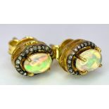 A Pair of Opal and Diamond Stud 925 Silver Earrings. Opal 2ctw and diamonds 0.35ctw. 2.73g total