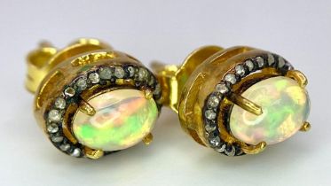 A Pair of Opal and Diamond Stud 925 Silver Earrings. Opal 2ctw and diamonds 0.35ctw. 2.73g total