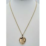 A 46cms 9K GOLD CHAIN WITH A 9K GOLD BACK AND FRONT PATTERNED LOCKET . 5.6gms
