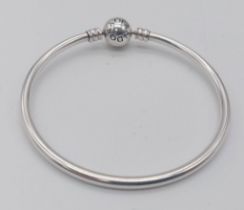 A 925 silver Pandora bangle. Total weight 8.4G. Diameter approx 6.5cm.