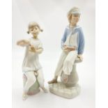 A Selection of Two Lladro Figurines. 22cm tallest piece.