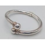 STERLING SILVER, HINGED TORQUE BANGLE. 7CM WIDE WEIGHT: 18.8G SC 8057