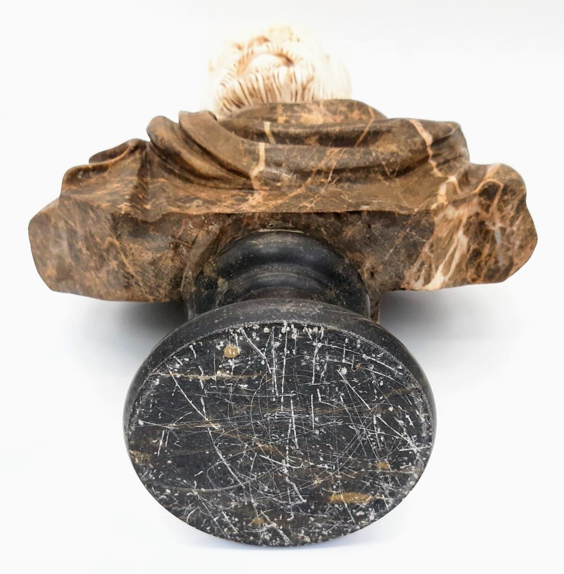 A Marble Bust of Distinct Grandeur. A black marble base, leads to a wonderfully selected veiny brown - Image 6 of 6