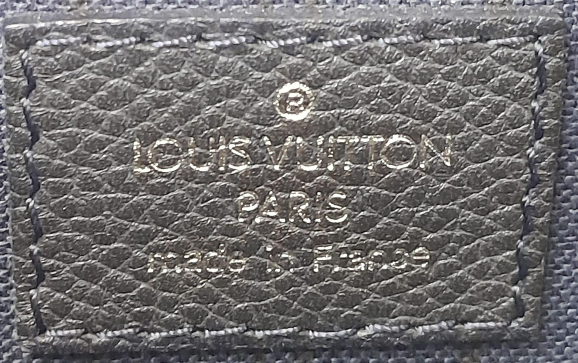 A Louis Vuitton Monogram Empreinte PM Tote Bag. Navy blue exterior with gold tone hardware. Spacious - Image 8 of 10