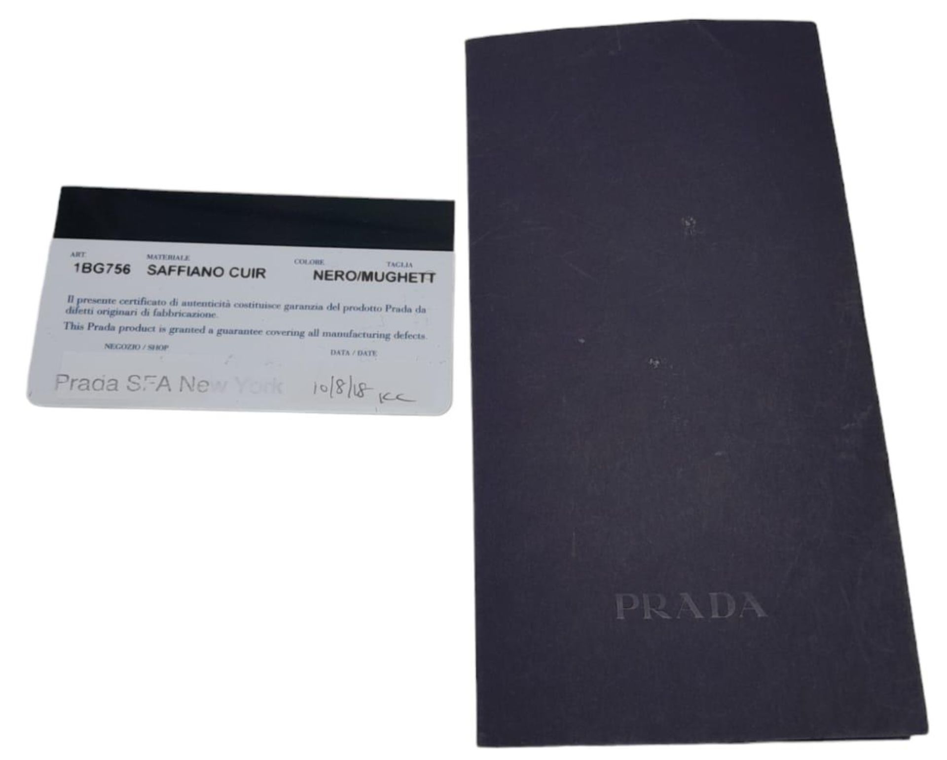 A Prada Black Leather Handbag. Textured black exterior with gold-tone hardware. Pastel pink - Image 9 of 9