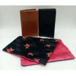 A collection of vintage designer leather wallets and a floral satin clutch. One Whitehouse Cox,