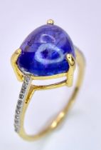 A 14K Yellow Gold Tanzanite Ring. 5ct central tanzanite with 0.10ctw of diamond accents. Size M. 2.