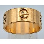 A 9K YELLOW GOLD CARTIER STYLE RING. Size M, 4.8g weight.