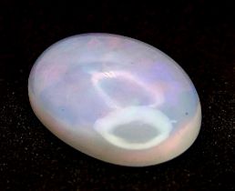 A 2.26ct Ethiopian White with Play of Color Natural Opal, in the Oval Cabochon shape. Comes with the