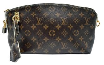 A Louis Vuitton Lockit Fetish Clutch Bag. Monogram canvas with gold tone hardware. Lock and keys.