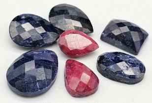 A Lot of 7 Pcs of Faceted Ruby and Blue Sapphire Gemstones in Mix Shapes. Total weight 69.60 Ct. GLI