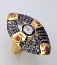 A unique, vintage, South African silver and gold ring with natural old cut diamonds and rubies.