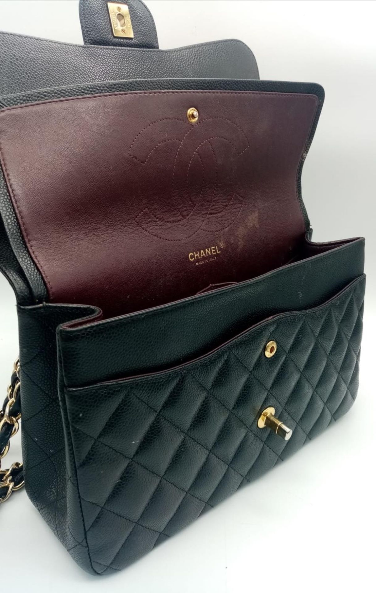A Chanel Black Caviar Classic Double Flap Bag. Quilted pebbled leather exterior with gold-toned - Image 7 of 11