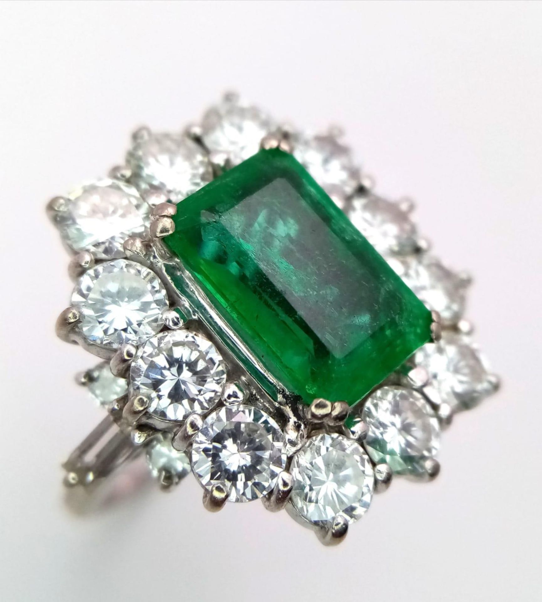 A Head-Turning 18K White Gold, Emerald and Diamond Ladies Dress Ring. Rectangular emerald with a - Image 3 of 7