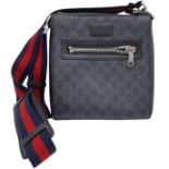 A Gucci Monogram Messenger Bag. GG grey canvas exterior wit black leather accents and zipped