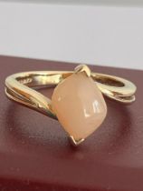 9 carat GOLD RING Set with a (1.0 carat) PINK OPAL. Lovely cradle mount with an attractive split
