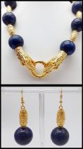 A majestic lapis lazuli and gold-filled Chinese dragons necklace and earrings set in a