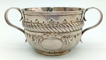 An Antique Georgian Sterling Silver Two-Handled Small Bowl. Chased and Repoussé decoration